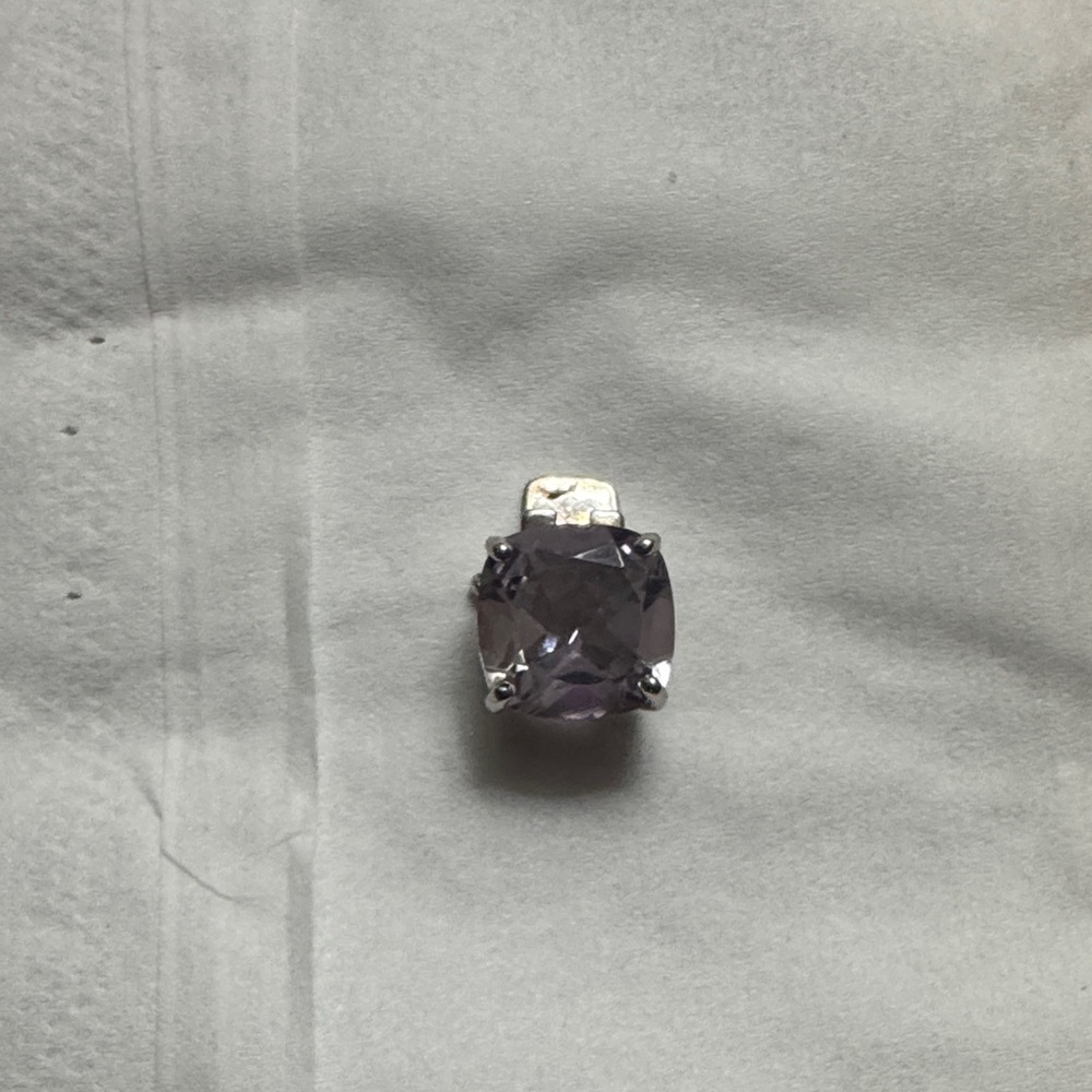 A sterling silver jewelry piece featuring a faceted Turkish diaspore gemstone.